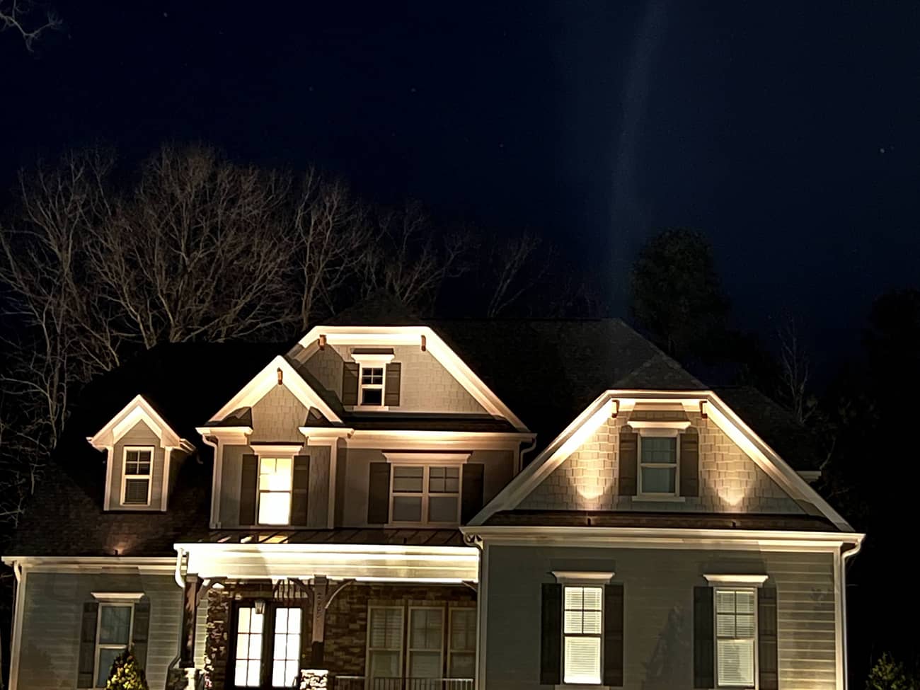 landscape lighting on home at night